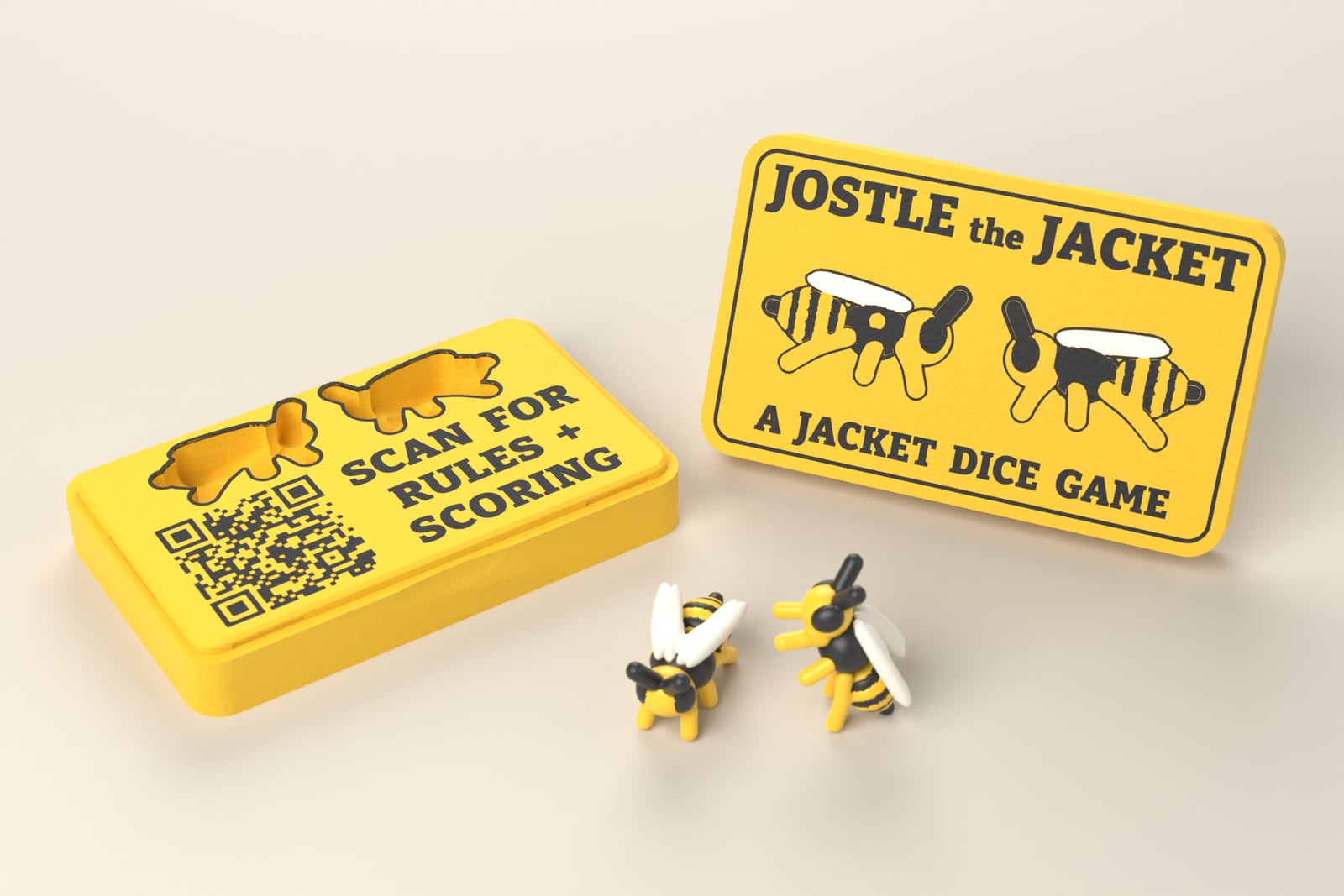 The open Jostle the Jacket case with its lid standing beside it and two jacket dice in front
