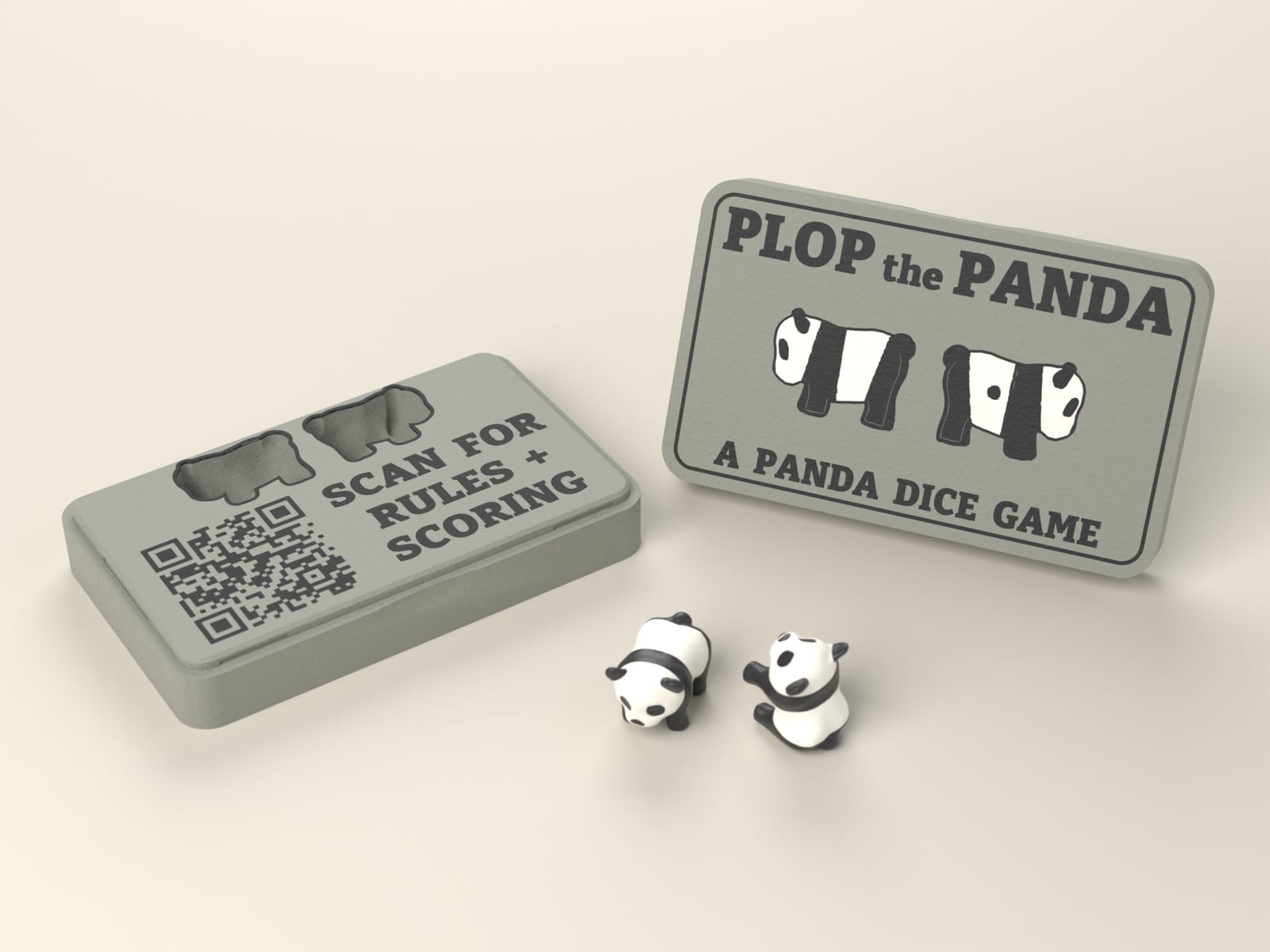 The open Plop the Panda case with its lid standing beside it and two panda dice in front