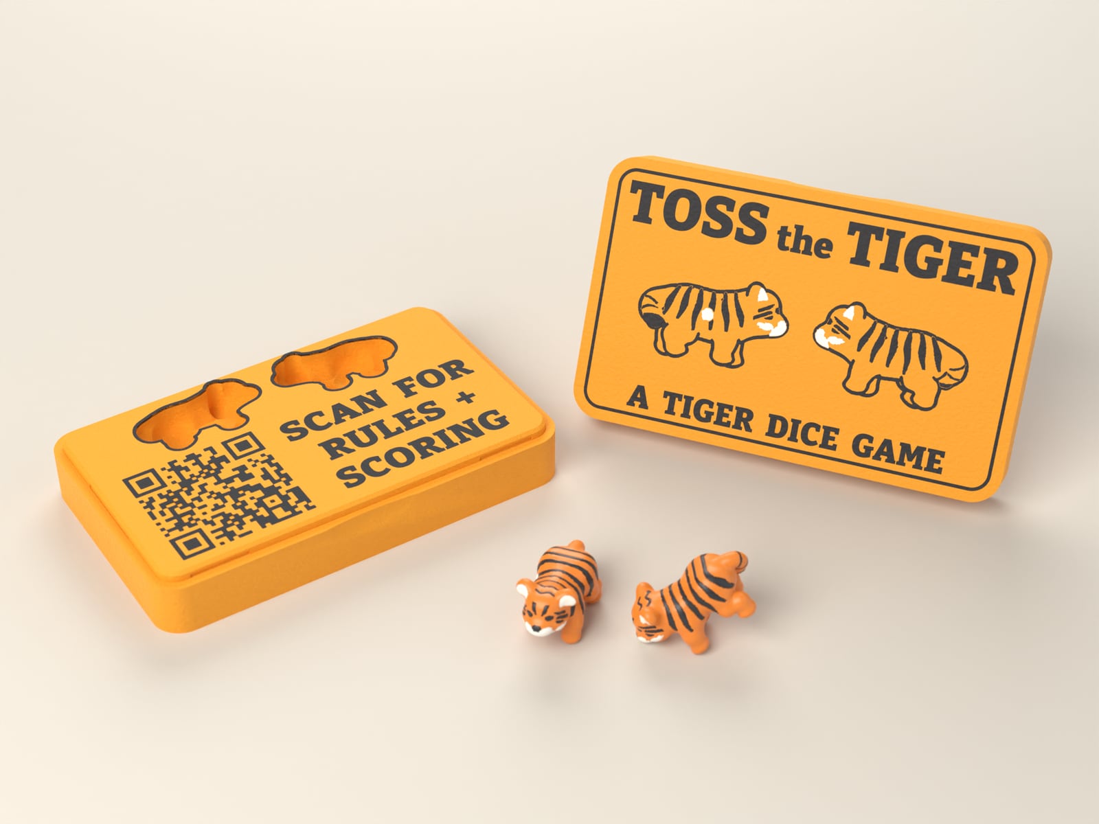The open Toss the Tiger case with its lid standing beside it and two tiger dice in front