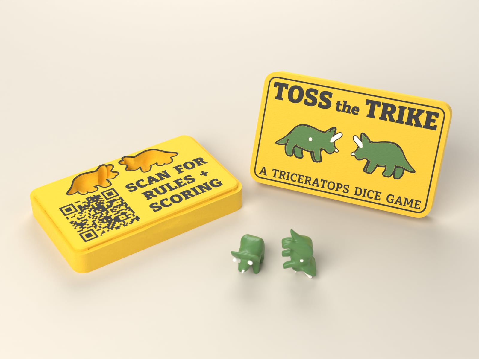 The open Toss the Trike case with its lid standing beside it and two trike dice in front